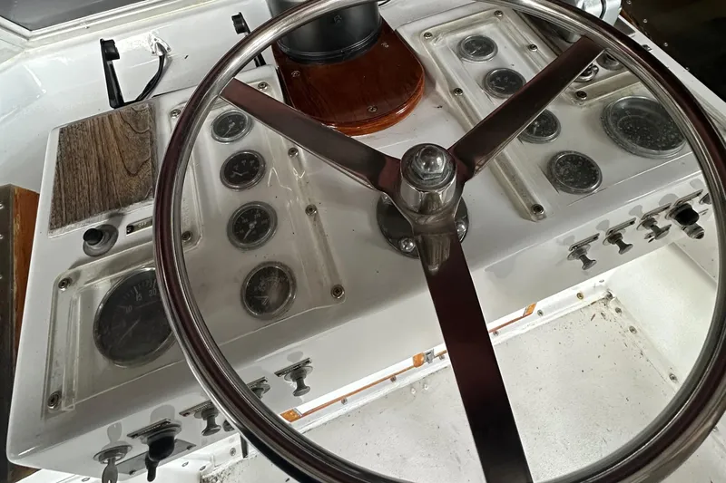 Apple 1 Yacht Photos Pics 1974 Hatteras 58 Yachtfish helm with vintage steering wheel and instrument panel.