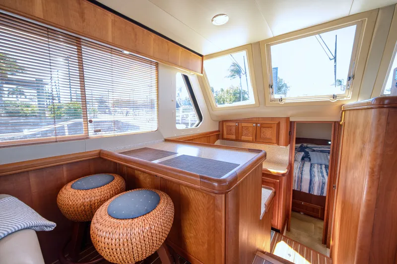 Oasis Yacht Photos Pics Interior of a 2006 Mainship 34 Trawler with wooden furnishings.