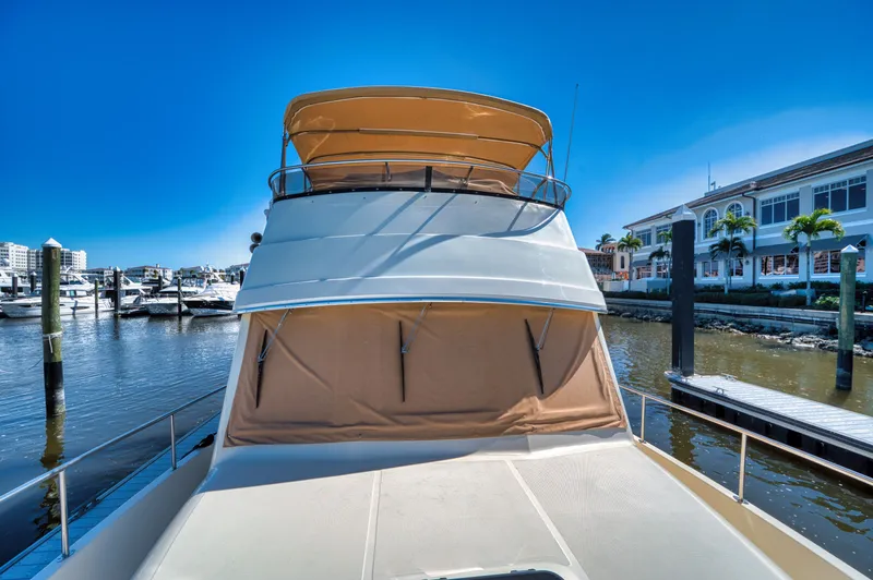 Oasis Yacht Photos Pics 2006 Mainship 34 Trawler docked in sunny marina.