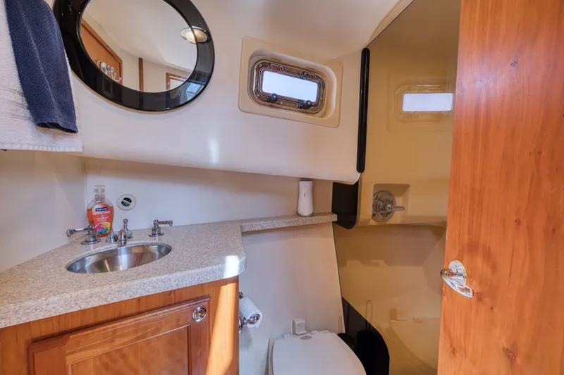 Oasis Yacht Photos Pics Bathroom in 2006 Mainship 34 Trawler with sink and toilet.