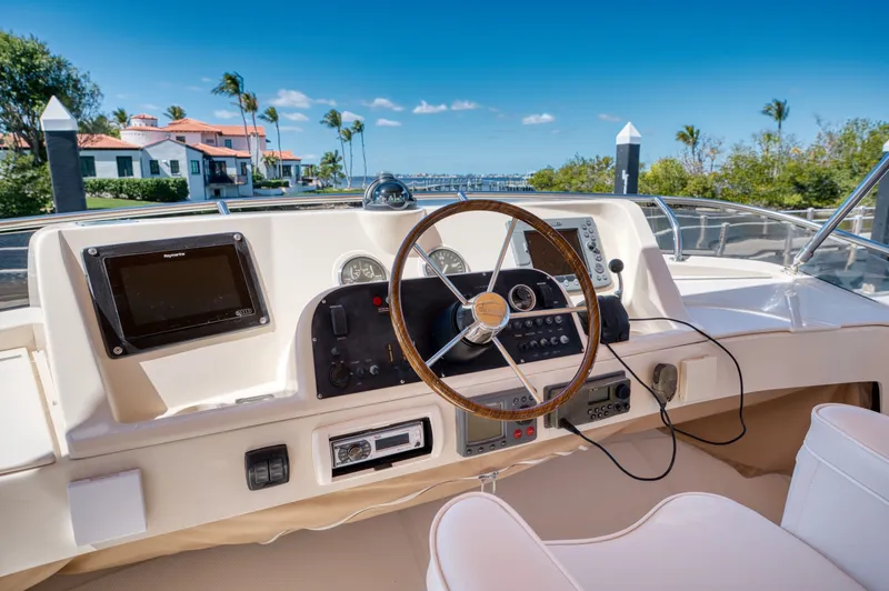 Oasis Yacht Photos Pics Mainship 34 Trawler 2006 helm with waterfront view.