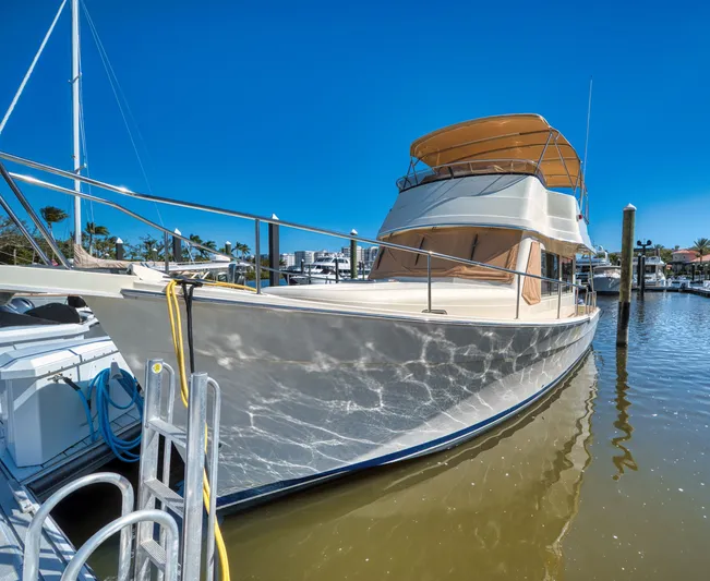 Oasis Yacht Photos Pics 2006 Mainship 34 Trawler docked in sunny marina.