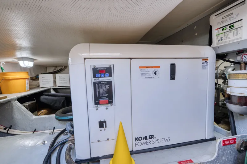 Oasis Yacht Photos Pics Kohler generator in the engine room of a 2006 Mainship 34 Trawler.