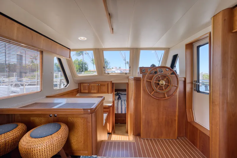 Oasis Yacht Photos Pics Interior of a 2006 Mainship 34 Trawler with wooden finish.