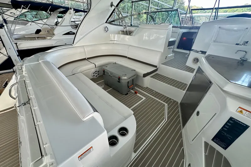 Somewhere With You Yacht Photos Pics 2009 Cruisers Yachts 460 Express interior with seating and kitchenette.