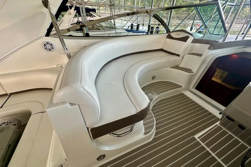 Somewhere With You Yacht Photos Pics Luxurious seating area on a 2009 Cruisers Yachts 460 Express with elegant white upholstery.