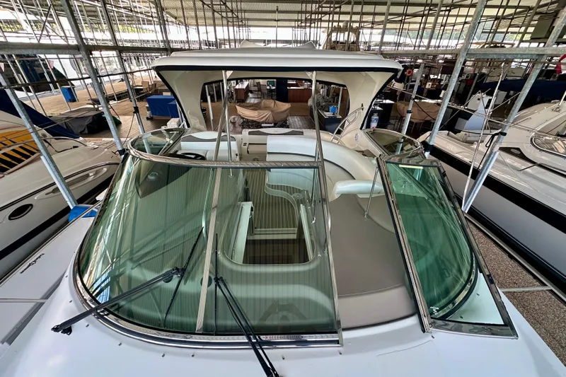 Somewhere With You Yacht Photos Pics 2009 Cruisers Yachts 460 Express in marina, showcasing sleek design and spacious deck.