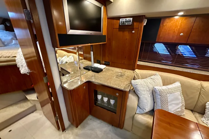 Somewhere With You Yacht Photos Pics Luxurious 2009 Cruisers Yachts 460 Express interior with cozy seating and modern amenities.