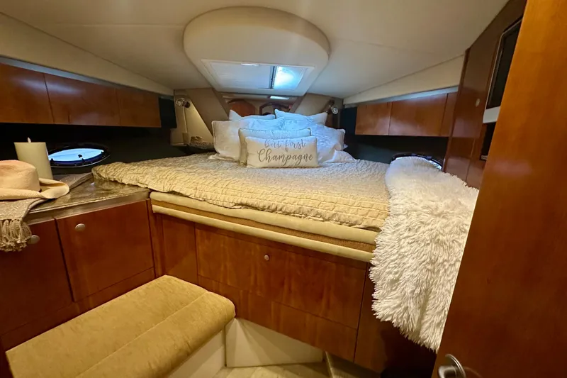 Somewhere With You Yacht Photos Pics Luxurious cabin interior of 2009 Cruisers Yachts 460 Express with cozy bedding.