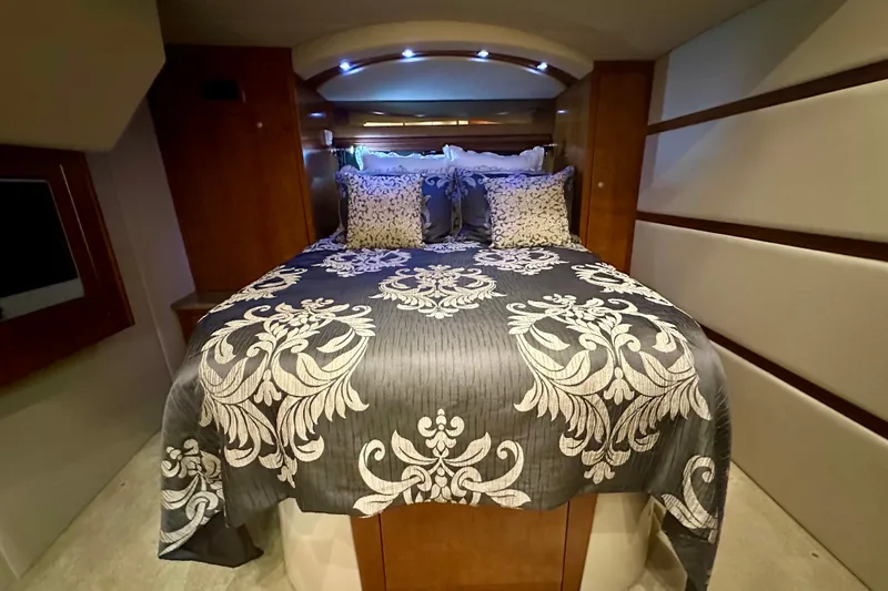 Somewhere With You Yacht Photos Pics Luxurious bedroom interior of 2009 Cruisers Yachts 460 Express with elegant bedding.