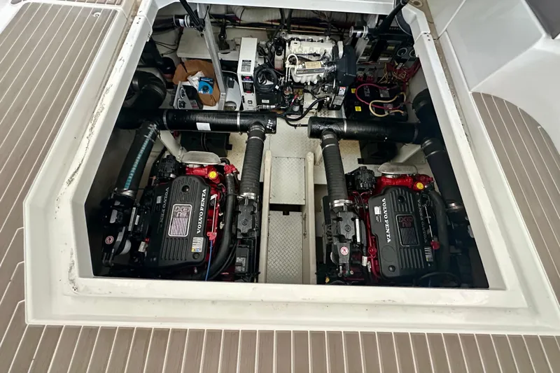 Somewhere With You Yacht Photos Pics Engine compartment of 2009 Cruisers Yachts 460 Express with Volvo Penta engines.