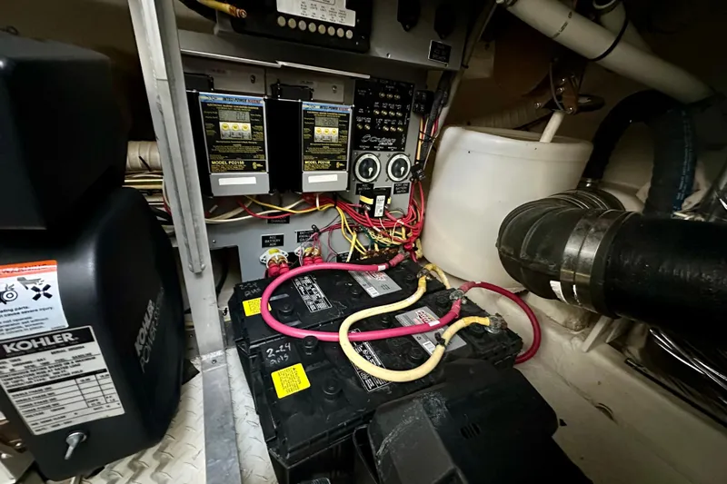 Somewhere With You Yacht Photos Pics Electrical system of 2009 Cruisers Yachts 460 Express, featuring batteries and wiring.