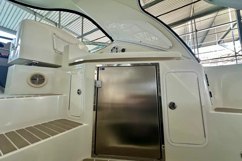 Somewhere With You Yacht Photos Pics 2009 Cruisers Yachts 460 Express interior with stainless steel door and modern design.