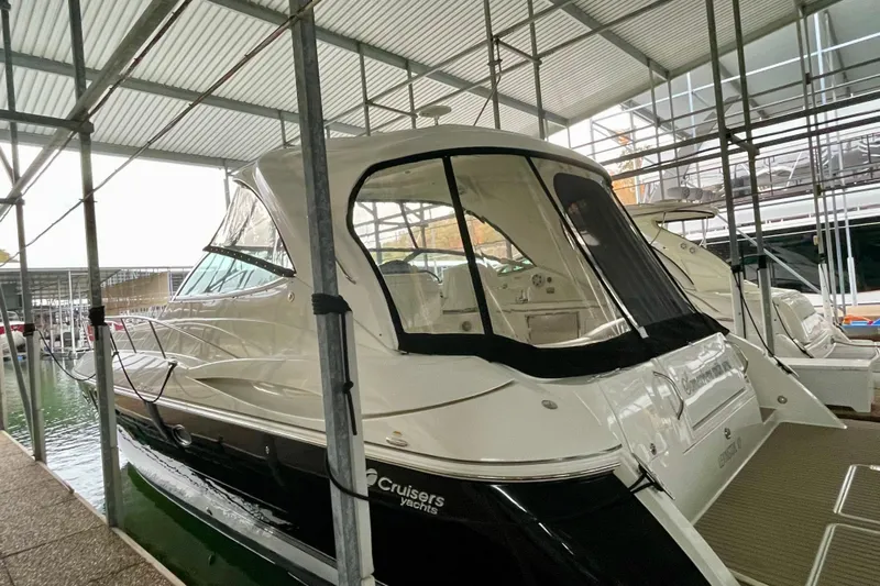 Somewhere With You Yacht Photos Pics 2009 Cruisers Yachts 460 Express docked in a covered marina.