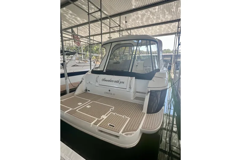 Somewhere With You Yacht Photos Pics 2009 Cruisers Yachts 460 Express docked, rear view with Lexington, KY signage.