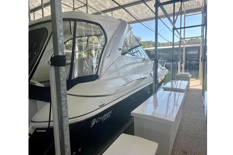 Somewhere With You Yacht Photos Pics 2009 Cruisers Yachts 460 Express docked under a covered marina.