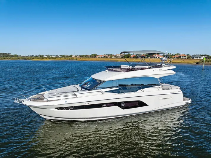 Pure De Papas Yacht Photos Pics 2019 Prestige 520 Fly yacht cruising on a sunny day.