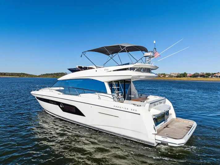Pure De Papas Yacht Photos Pics 2019 Prestige 520 Fly yacht cruising on a sunny day.