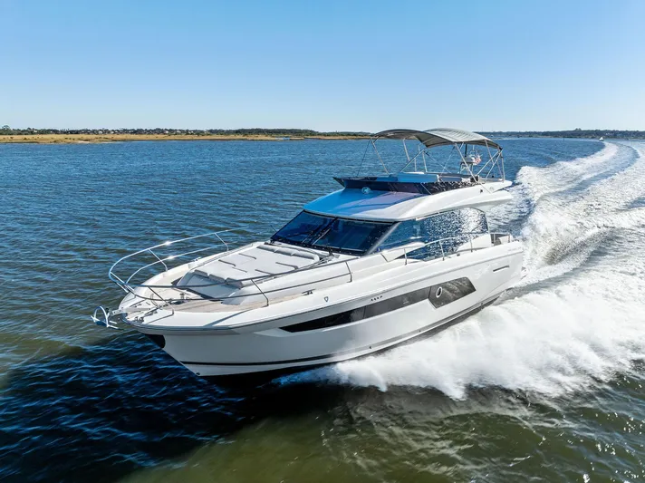 Pure De Papas Yacht Photos Pics 2019 Prestige 520 Fly yacht cruising on open water.