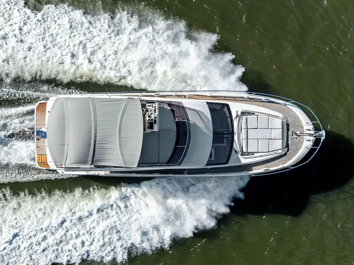 Pure De Papas Yacht Photos Pics Aerial view of 2019 Prestige 520 Fly yacht cruising on water.