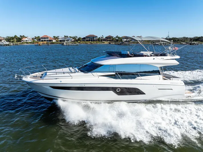 Pure De Papas Yacht Photos Pics 2019 Prestige 520 Fly yacht cruising on a sunny day.