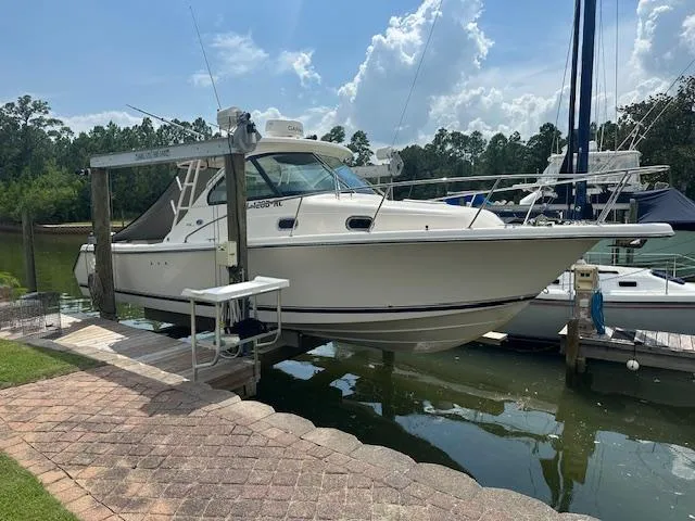  Yacht Photos Pics 2012 Pursuit OS 315 Offshore boat docked on a sunny day.