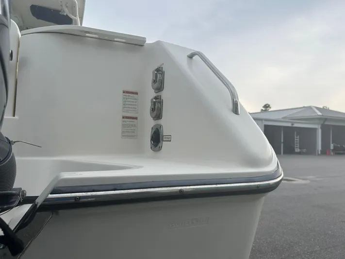  Yacht Photos Pics 2012 Pursuit OS 315 Offshore boat stern with warning labels and handle.