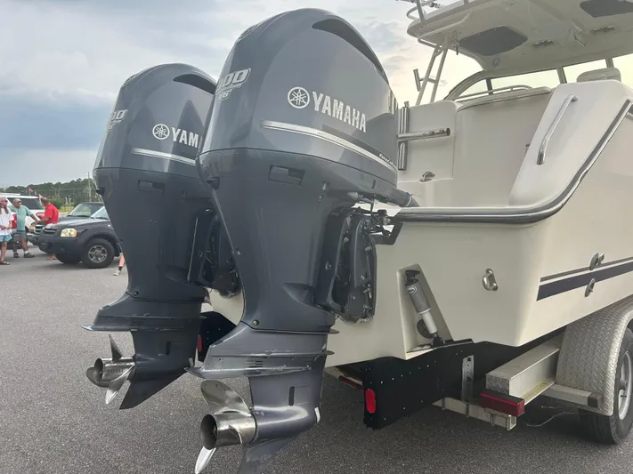  Yacht Photos Pics 2012 Pursuit OS 315 Offshore boat with dual Yamaha outboard engines on a trailer.