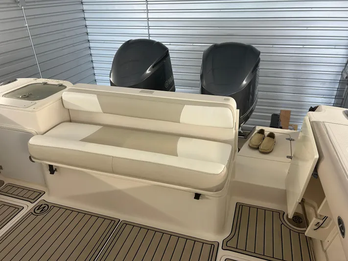  Yacht Photos Pics 2012 Pursuit OS 315 Offshore boat interior with seating and twin engines.