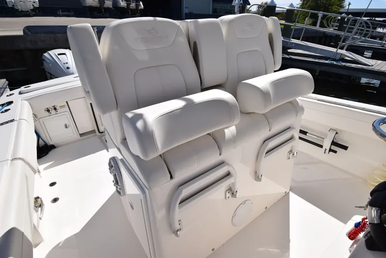 Salty Dog Yacht Photos Pics 2023 Regulator 31 boat with luxurious white seating at the helm.