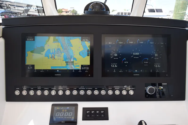 Salty Dog Yacht Photos Pics 2023 Regulator 31 boat dashboard with dual Garmin displays and control panel.
