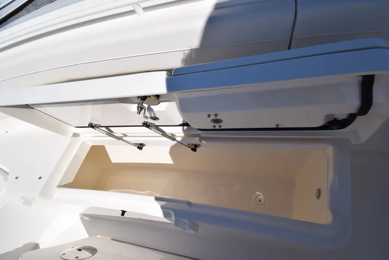 Salty Dog Yacht Photos Pics Open storage compartment on a 2023 Regulator 31 boat, showcasing interior space.