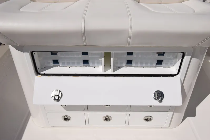 Salty Dog Yacht Photos Pics 2023 Regulator 31 boat storage compartment with tackle boxes and secure latches.