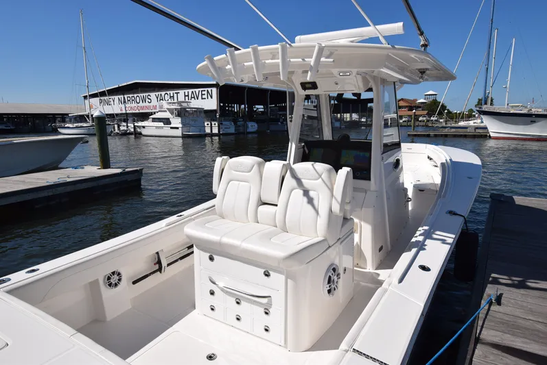 Salty Dog Yacht Photos Pics 2023 Regulator 31 boat docked at Piney Narrows Yacht Haven, featuring sleek white seating.