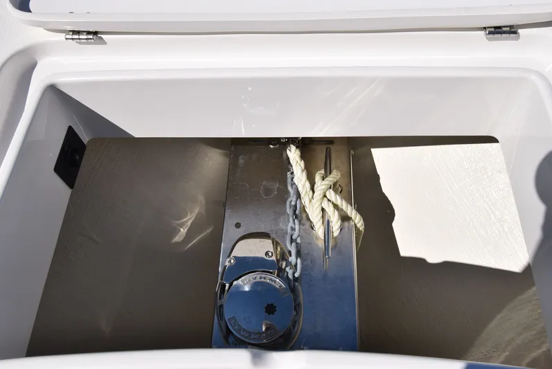 Salty Dog Yacht Photos Pics Anchor storage compartment on 2023 Regulator 31 boat with rope and chain.