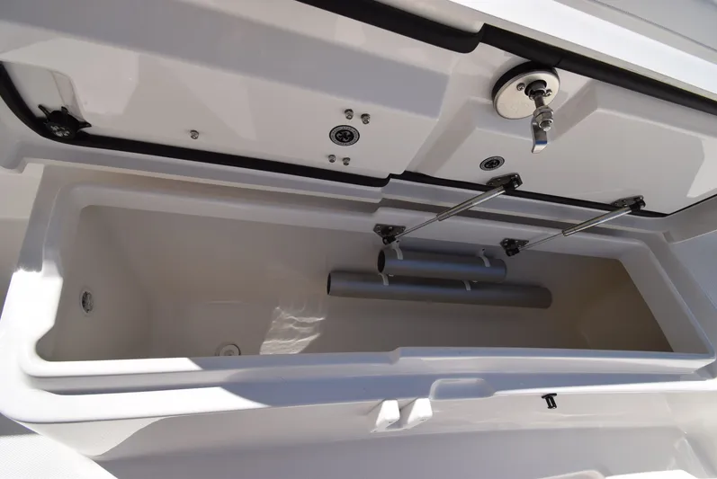 Salty Dog Yacht Photos Pics Open storage compartment on a 2023 Regulator 31 boat, showcasing interior details.