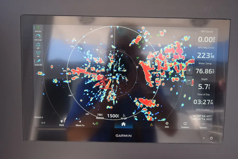 Salty Dog Yacht Photos Pics Garmin marine radar display on 2023 Regulator 31 boat, showing navigation data and sea conditions.