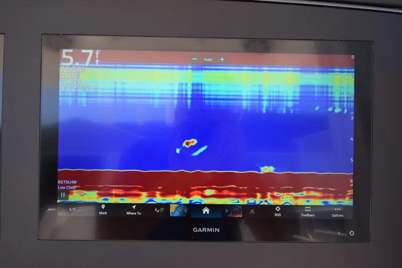 Salty Dog Yacht Photos Pics Garmin sonar display on 2023 Regulator 31 boat, showing underwater depth and temperature.