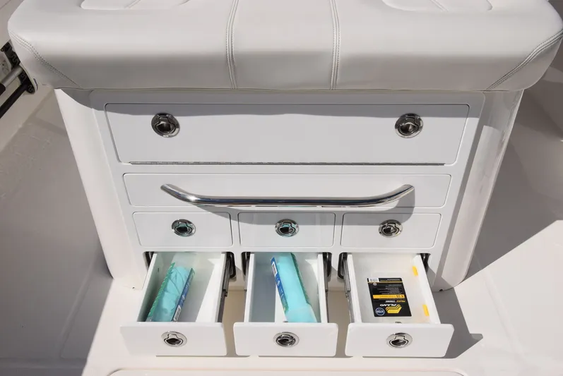 Salty Dog Yacht Photos Pics 2023 Regulator 31 boat storage drawers with fishing gear and accessories.