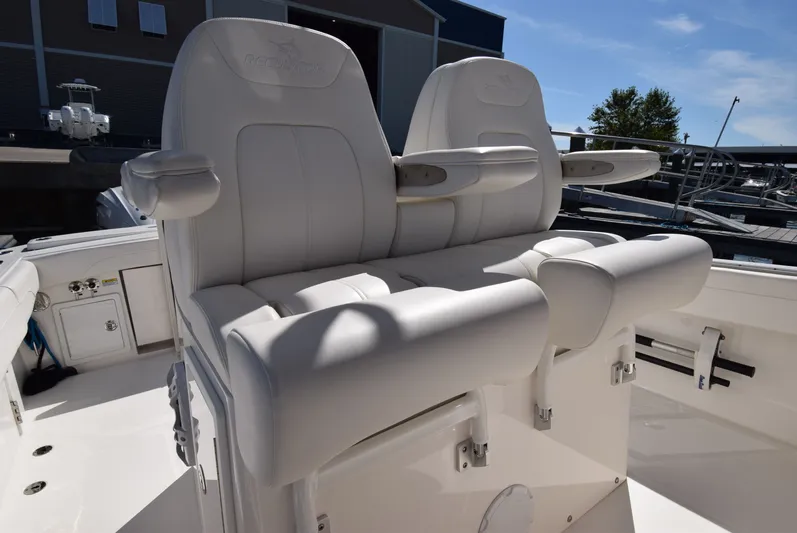 Salty Dog Yacht Photos Pics 2023 Regulator 31 boat with luxurious white seating and armrests.