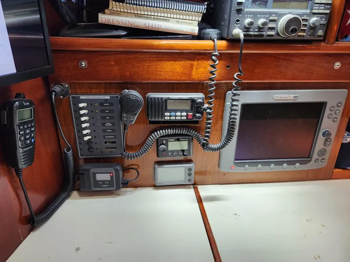 Magic Carpet Yacht Photos Pics Control panel of a 1983 Challenger Custom 60 boat with communication and navigation equipment.