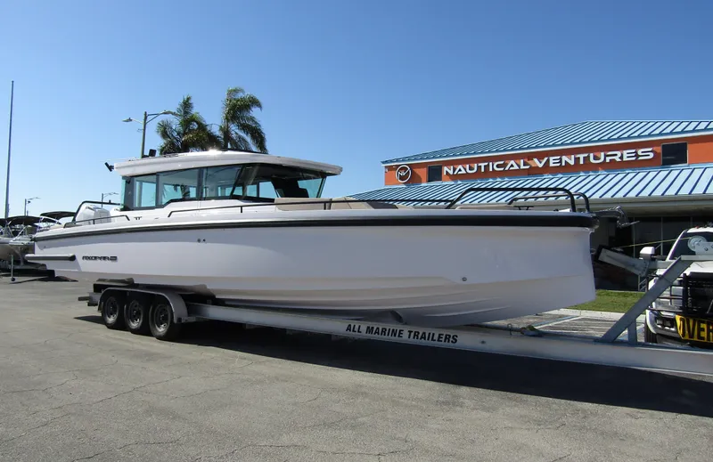  Yacht Photos Pics 2025 Axopar 37XC CROSS CABIN boat on trailer at Nautical Ventures dealership.