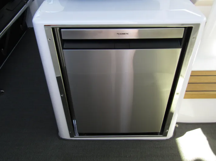  Yacht Photos Pics Stainless steel refrigerator in 2025 Axopar 37XC CROSS CABIN boat interior.