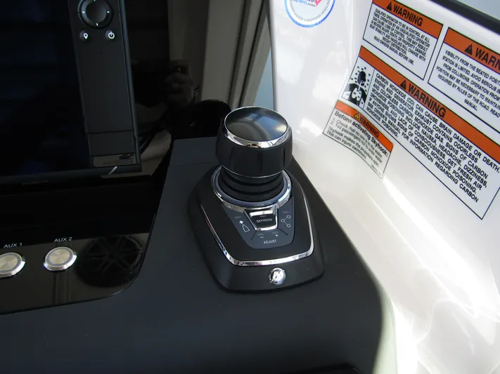  Yacht Photos Pics Axopar 37XC CROSS CABIN 2025 joystick control with warning labels.