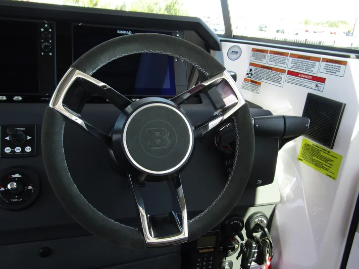  Yacht Photos Pics Steering wheel of 2025 Axopar 37XC CROSS CABIN boat cockpit.