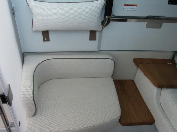  Yacht Photos Pics Luxurious seating in 2025 Axopar 37XC CROSS CABIN with wooden accents.
