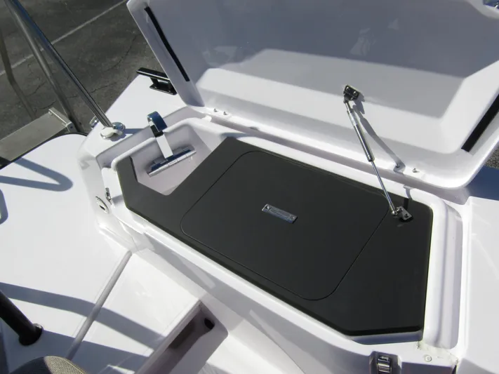  Yacht Photos Pics 2025 Axopar 37XC CROSS CABIN storage compartment with open lid.