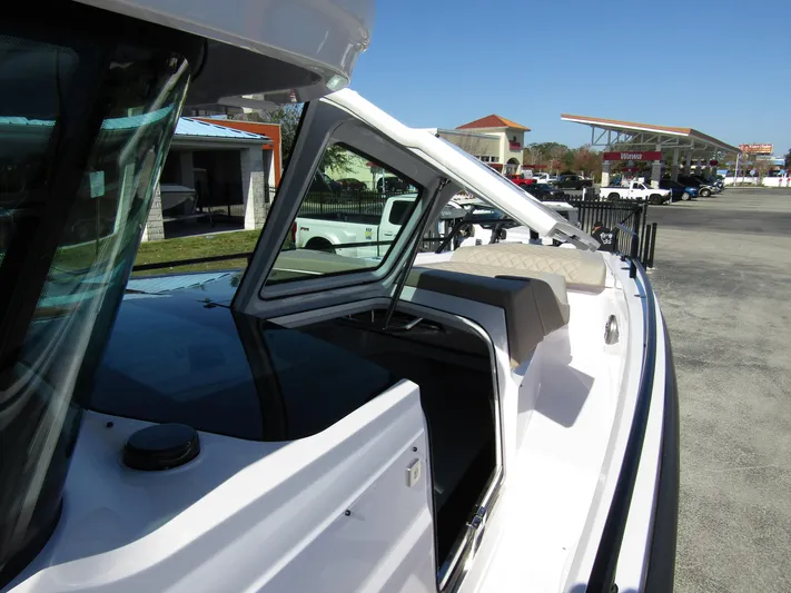  Yacht Photos Pics 2025 Axopar 37XC CROSS CABIN boat exterior with open cabin door.