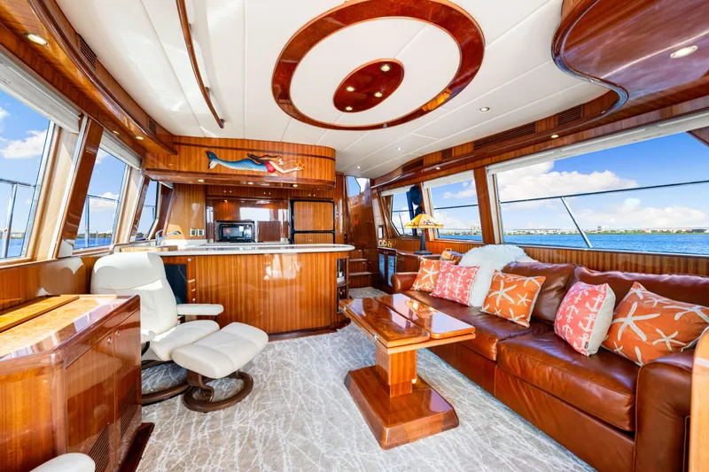 Gypsy Spirit Yacht Photos Pics Luxurious 2007 Hampton 558 Pilothouse interior with elegant wood finishes and ocean views.