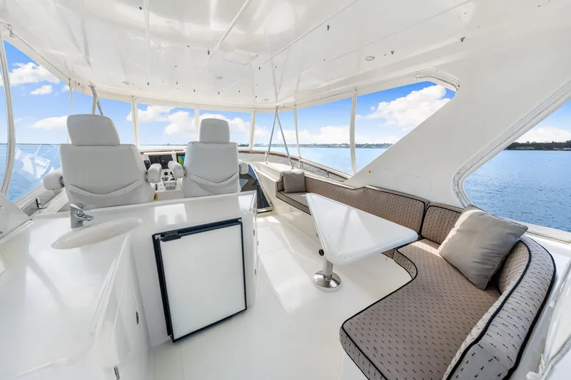 Gypsy Spirit Yacht Photos Pics Luxurious 2007 Hampton 558 Pilothouse yacht interior with seating and ocean view.